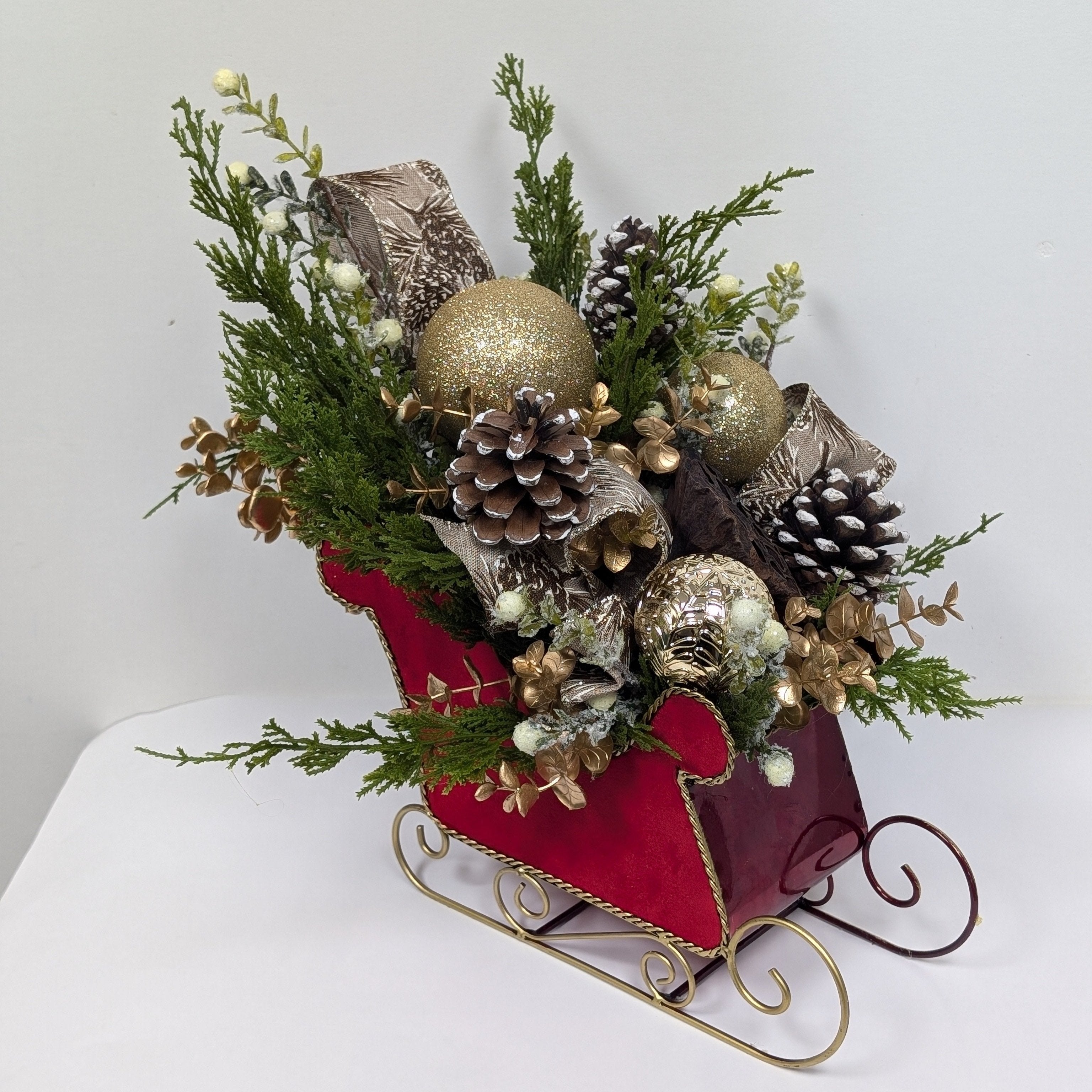 Sleigh Bells Ring | Festive Christmas Silk Flower Arrangement with Greenery & Pinecones in Decorative Sleigh