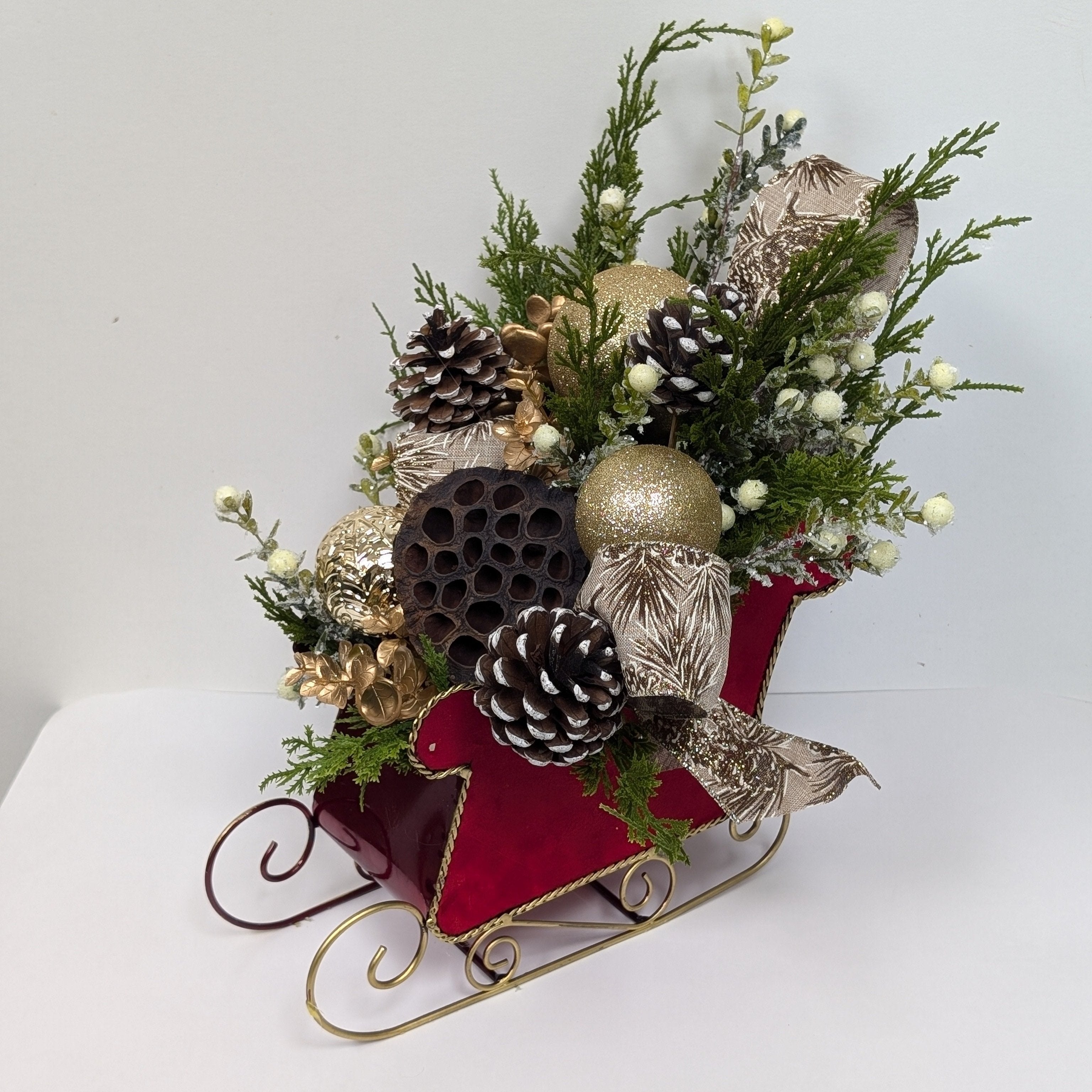 Sleigh Bells Ring | Festive Christmas Silk Flower Arrangement with Greenery & Pinecones in Decorative Sleigh